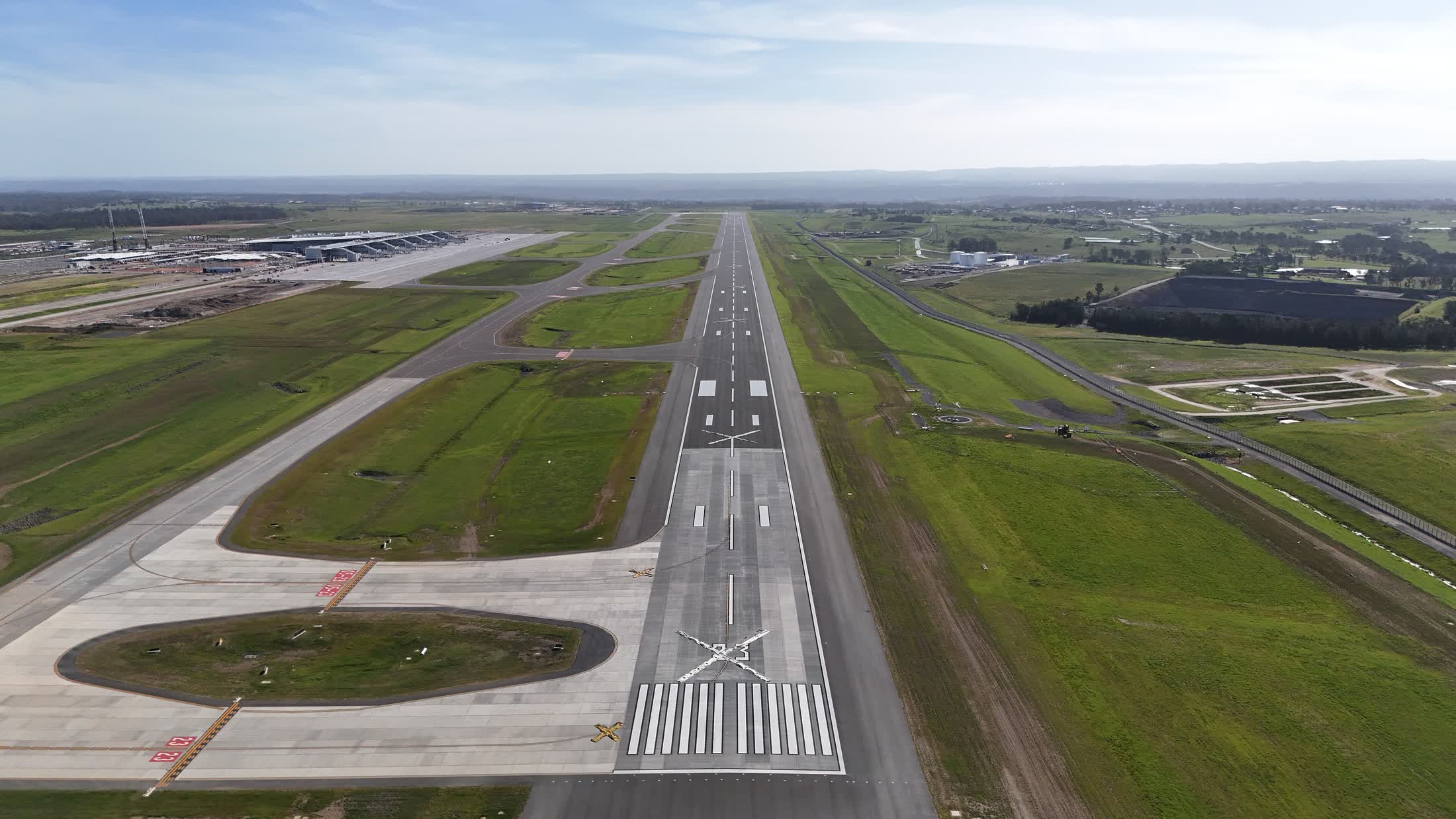 An aerial view straight down a runway